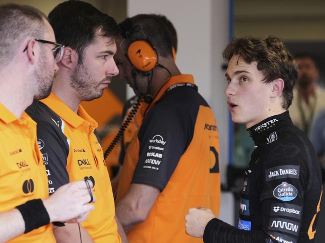 Oscar Piastri, right, of Australia talks with his team in Miami. Picture: AP Photo/Rebecca Blackwell