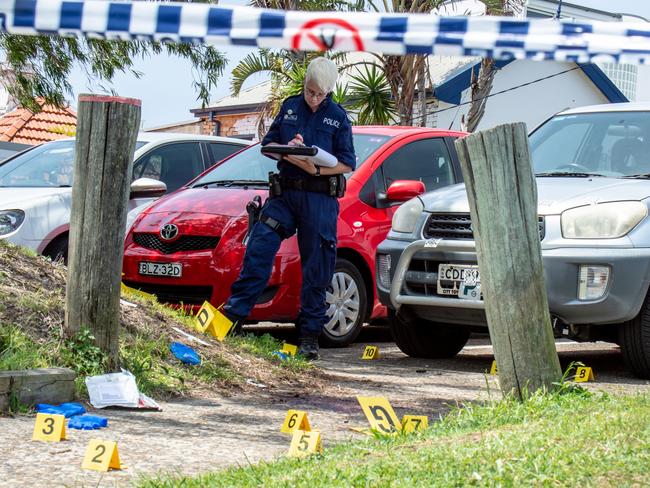 Police at the scene of the alleged murder in a Queenscliff park.