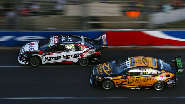 Kelly Racing driver Simona De Silvestro passes Brad Jones Racing driver Nick Percat in the Gold Coast 600 Supercars race, held at the Surfers Paradise circuit. PICTURE: BRENDAN RADKE