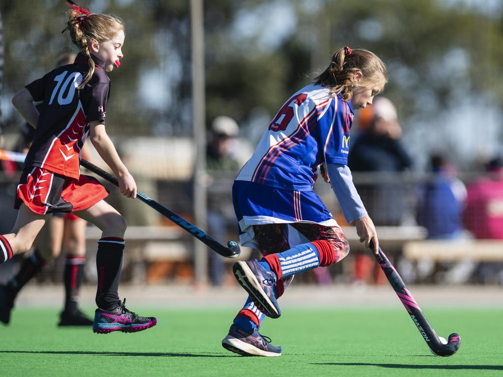 Mali Robertson (left) of Past High gives chase to Makaylah Hawken of Rangeville against Past High in under-11 girls Presidents Cup hockey at Clyde Park, Saturday, May 27, 2023. Picture: Kevin Farmer