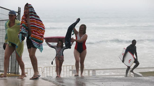 A beach day turned nasty in matter of minutes. Picture: Mike Dugdale