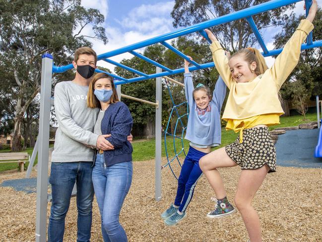 Sam and Matt Cameron with daughters Poppy, 8 (blue Top) and Daisy, 11 (yellow top) for the Federal Budget coverage on Oct 6. Picture: Tim Carrafa