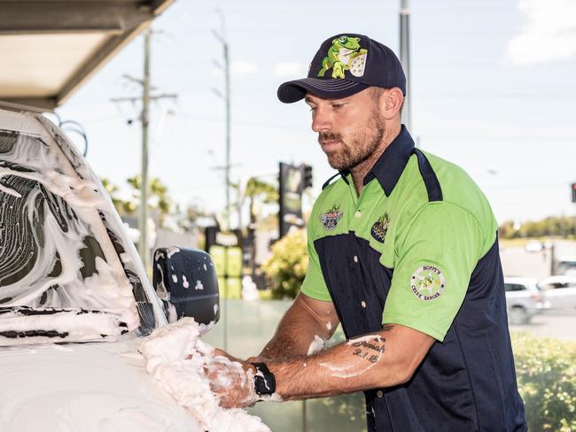Supplied image of Gold Coast Titans players Phillip Sami (left) and Bryce Cartwright (right) washing cars