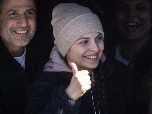 TEL AVIV, ISRAEL - JANUARY 25: Hostage, Daniella Gilboa gives thumbs up to the waiting crowd from the door of the helicopter after arriving at Belinson-Schneider Hospital on January 25, 2025 in Tel Aviv, Israel. Today brings the release of four more Israeli hostages held by Hamas in Gaza, the second such exchange under the current ceasefire agreement that began one week ago. (Photo by Chris McGrath/Getty Images)