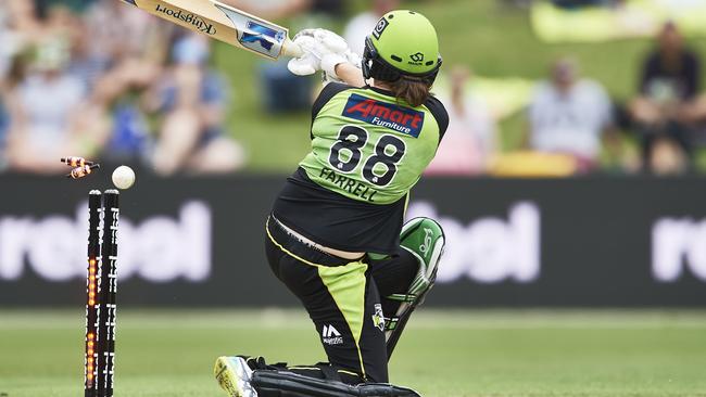 Rene Farrell of the Thunder is bowled out by Brisbane’s Jemma Barsby.