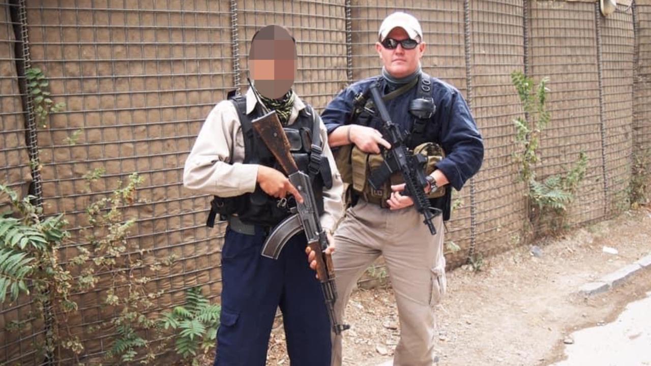 Australian Embassy in Kabul head of security Paul Johnstone with a local contracted guard who managed to get on one of the last ADF flights out of Kabul. Picture: Supplied