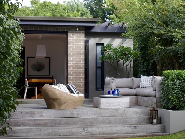 A built-in sofa in this space by Secret Gardens is complemented by versatile extra seating. Picture: Nicholas Watt