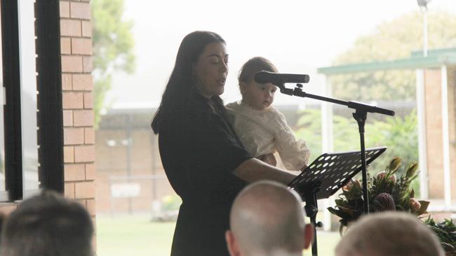 MY CAMERON: Tara holds daughter Lennie as she speaks from the heart to more than 500 people about her love for Cameron Rodney Hyde, who passed away from cancer. Photo: Alison Paterson