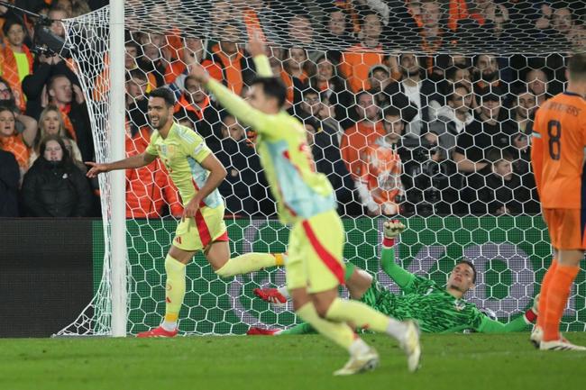 Mikel Merino celebrates his last-ditch equaliser for Spain