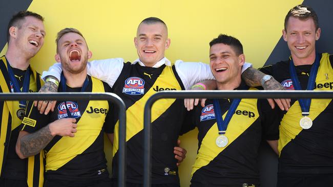 Premiership Tigers Jack Riewoldt, Brandon Ellis, Dustin Martin, Dion Prestia and Dylan Grimes enjoy the spoils of victory at Punt Rd.