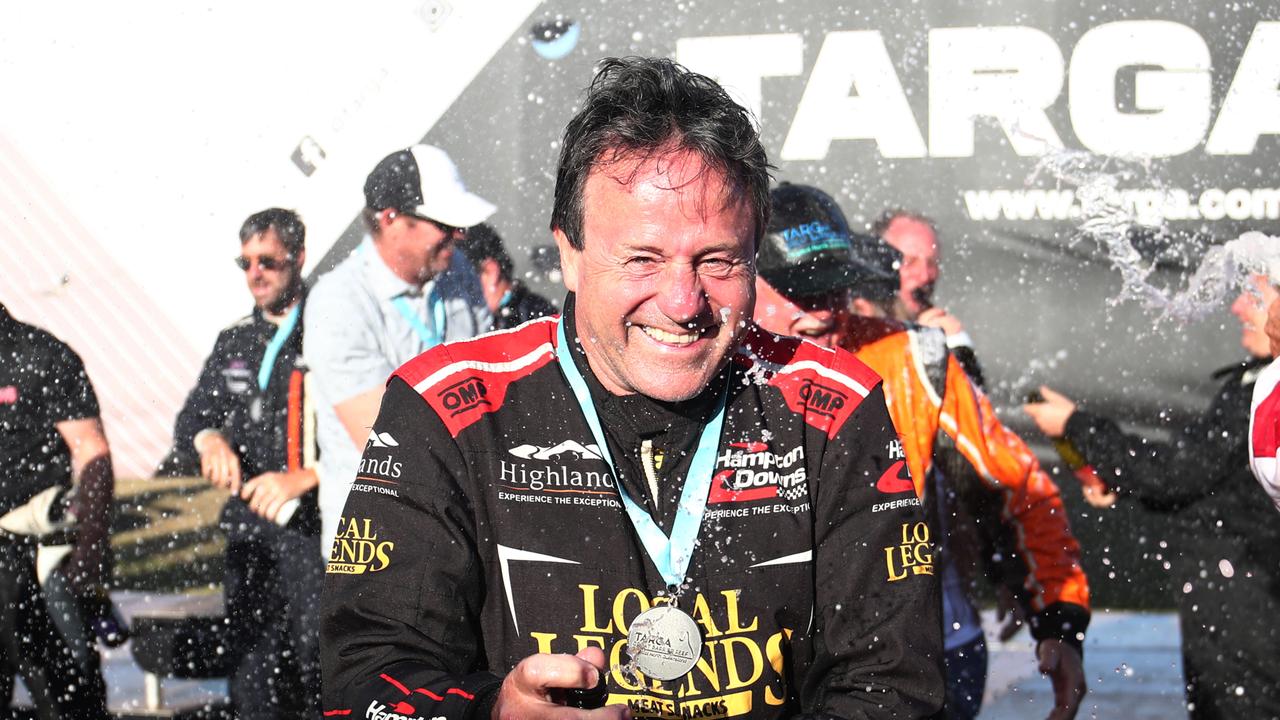 Tony Quinn sprays champagne on the podium after winning the Targa Great Barrier Reef with co driver Brian Foster in the 2018 Nissan GT-R R35. PICTURE: BRENDAN RADKE