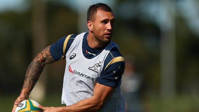 SUNSHINE COAST, AUSTRALIA - JULY 07: Quade Cooper of the Wallabies passes during an Australian Wallabies training session on July 7, 2015 in Sunshine Coast, Australia. (Photo by Cameron Spencer/Getty Images)