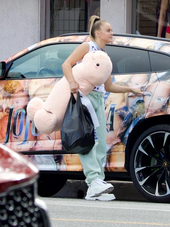 She was carrying around a plush penis. Picture: Splash News/Media Mode