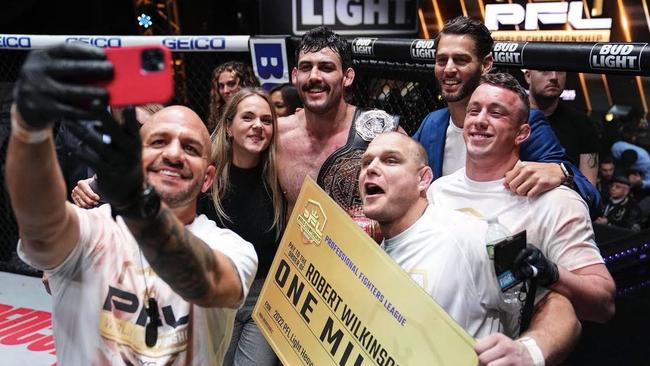 Rob with supporters after the win. Tasmanian fighter Rob Wilkinson has completed his rise from a battler from Hobart to one of the worldÃ&#149;s best after a smashing defeat of Russian Omari Akhmedov to claim the Professional Fighters League Light-Heavyweight Championship and a monster $1.5m pay day in New York City. Picture: supplied