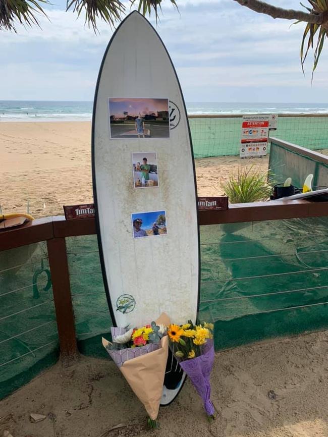 Friends farewelled Nick Slater during an intimate paddle out at Burleigh Heads.  Picture:  Laurie Minto