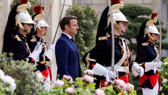 Emmanuel macron reviews troops in the gardens of the Elysee after his inauguration on Saturday. Picture: AFP