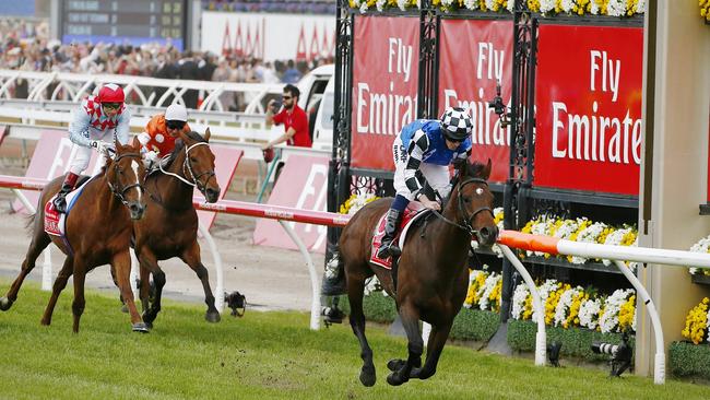 Protectionist ridden by Ryan Moore wins the Melbourne Cup, with Red Cadeaux second for the third year.