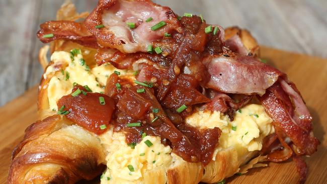 Breakfast croissant with scrambled eggs and bacon served at Burleigh Social, Burleigh, Gold Coast. Picture: Regi Varghese