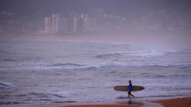 Sunrise at North Narrabeen Beach, where some locals say they are embarrassed by the COVID-19 graffiti. Picture: John Grainger