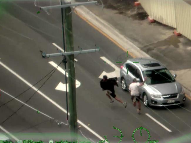 Reece Brown, in the white shirt, chases the alleged thief. Picture: Polair/Queensland Police