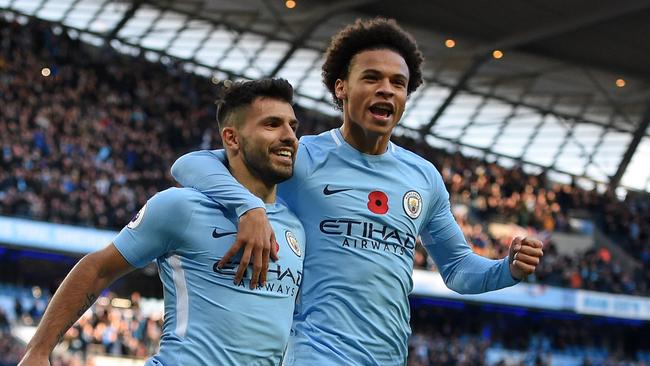 Manchester City's Argentinian striker Sergio Aguero (L) celebrates with Manchester City's German midfielder Leroy Sane (R).