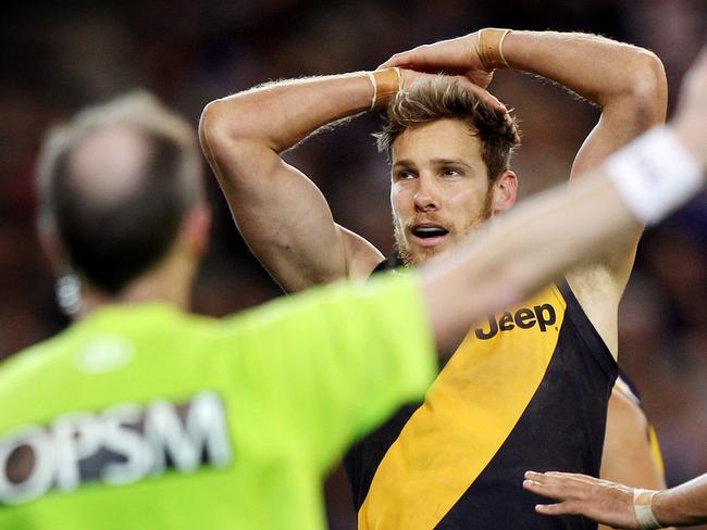 Richmond v North Melbourne. MCG.  Luke McGuane cant believe his luck after giving away a free kick to Drew Petrie during the last qtr