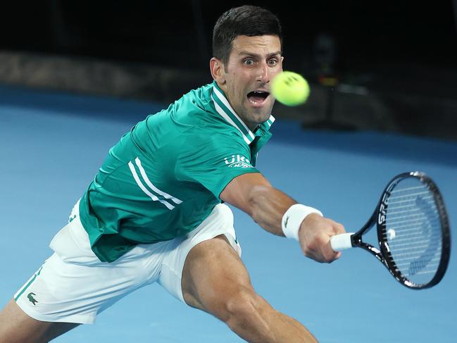 Australian Open tennis. 16/02/2021. Day 9.. Novak Djokovic vs Alexander Zverev on Rod Laver Arena.   Novak Djokovic stretching backhand 4th set   . Pic: Michael Klein