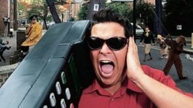 Comedian Dom Joly and his giant phone. Picture: X