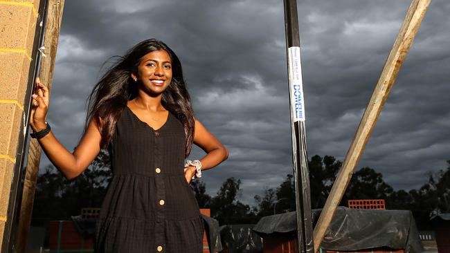 Keziah Solomon, 22, inspects progress at the West Australian construction site she help fund with the HomeBuilder stimulus. Picture: Colin Murty