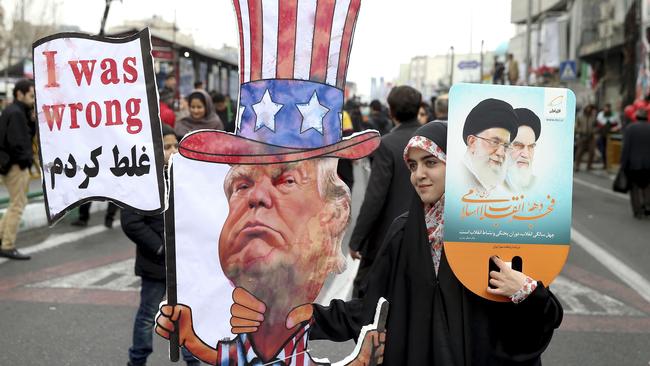 An Iranian woman holds an effigy of US president Donald Trump. Picture: AP Photo/Ebrahim Noroozi