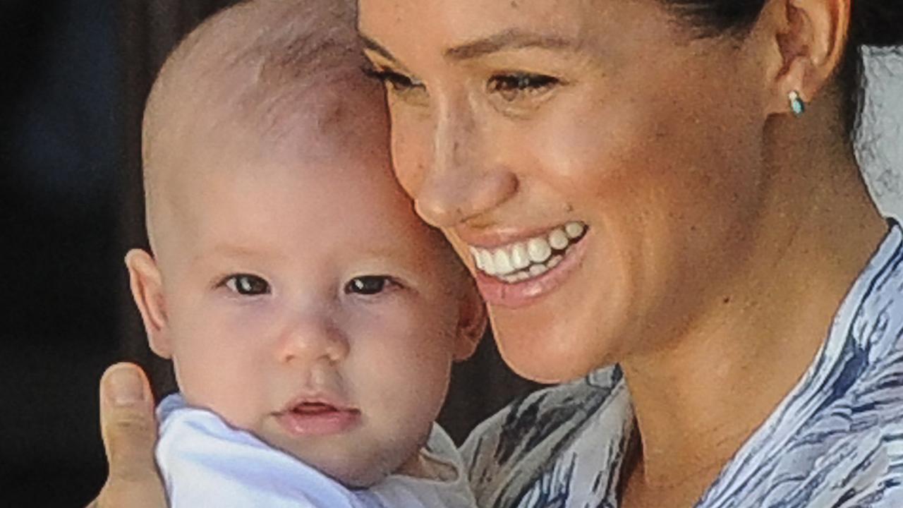 Meghan holds her son Archie as she and Prince Harry meet Archbishop Desmond Tutu. Picture: Henk Kruger / POOL / AFP