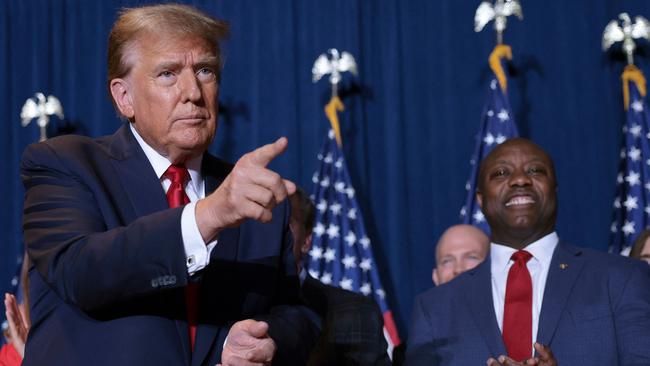 Donald Trump and senator Tim Scott enjoy the result at an election night watch party in Columbia, South Carolina. Picture: Getty Images via AFP