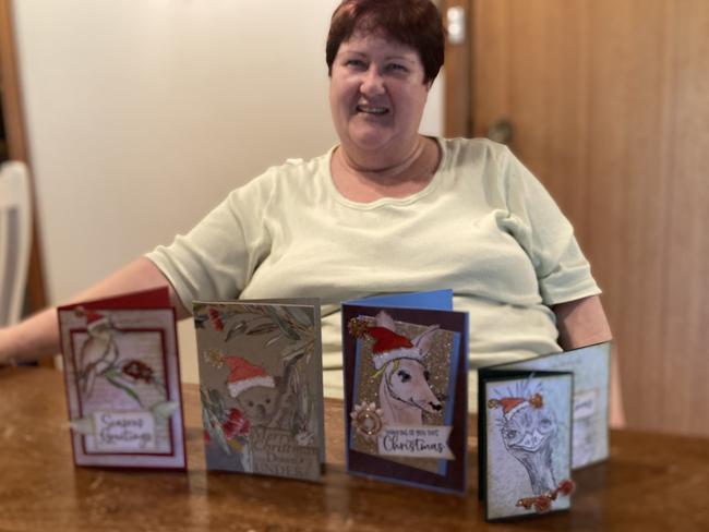 Kathryn Slavin with Christmas cards she also makes. Picture: Ryan Young