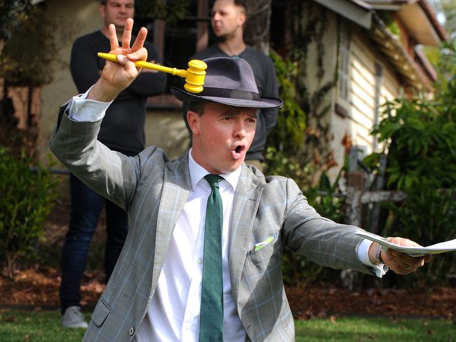 Ray White New Farm auctioneer Haesley Cush in action for the auction of 139 Sirius St, Coorparoo.Property Auction at 139 Sirius St, Coorparoo.Saturday June 30, 2018. (AAP image, John Gass)