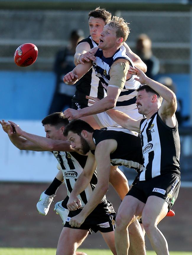 Yarrawonga’s Leigh Williams crashes the pack in the grand final. Picture: Yuri Kouzmin