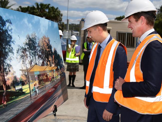 Premier Mike Baird and Minister for Transport and Infrastructure Andrew Constance look over plans for the B-Line last year. Picture: Martin Lange