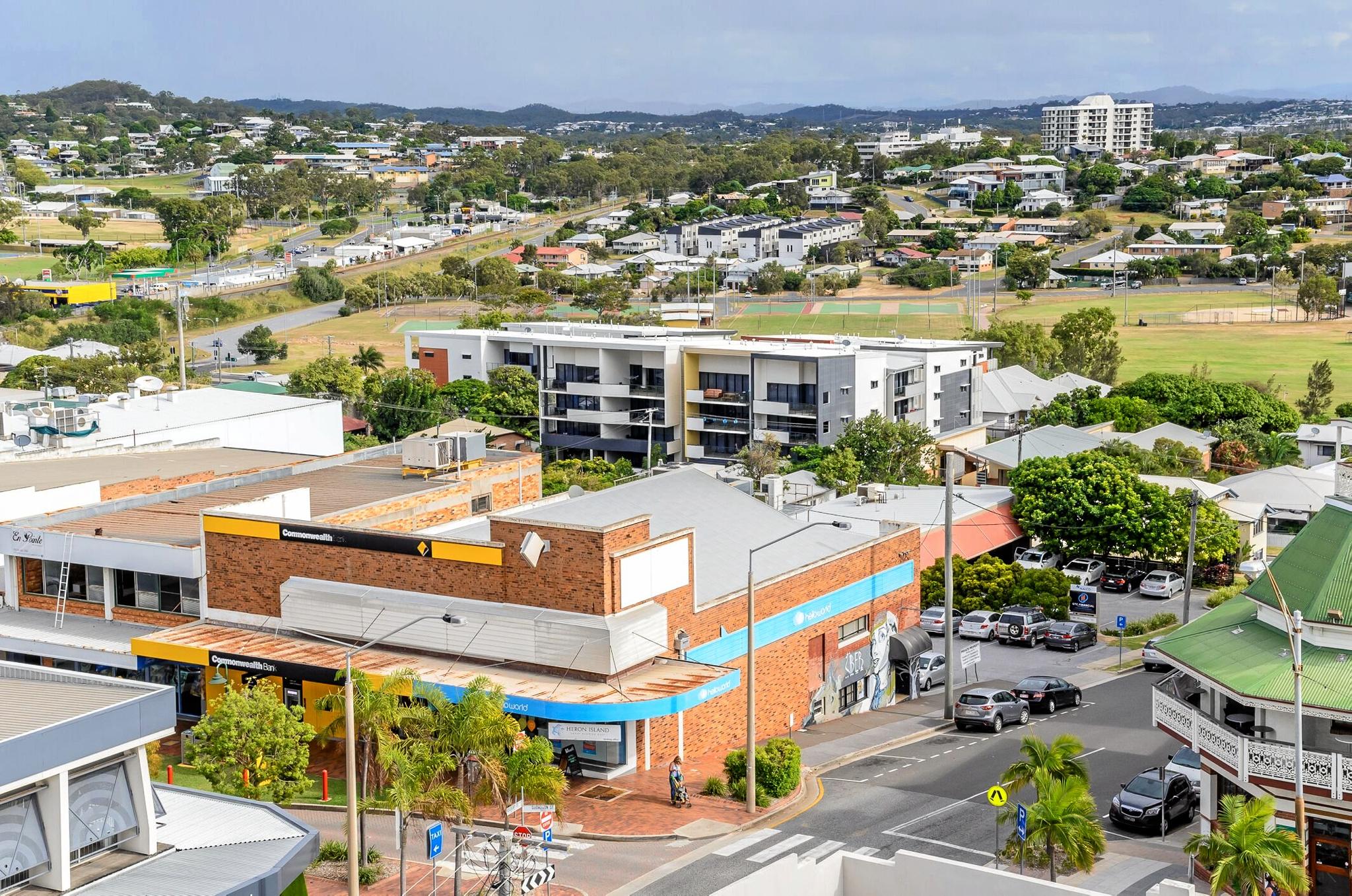 LJ Hooker has listed 81 Goondoon St, where Commonwealth Bank, Uber Hair and Hello World are, for sale.