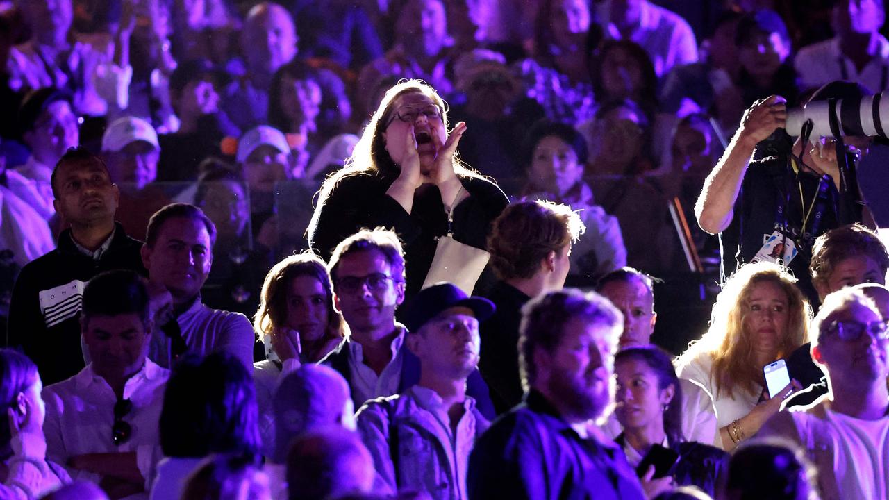 “Nina” seen protesting after the men’s final. (Photo by Martin KEEP / AFP)