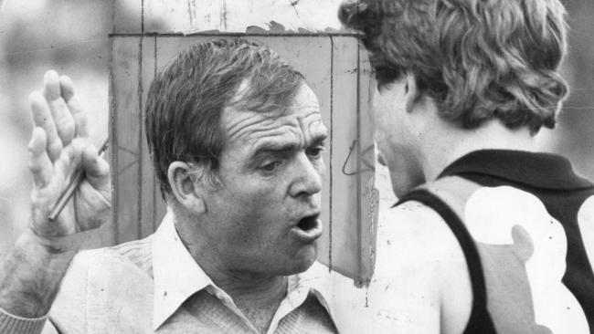 Neil Kerley pictured when he was West Adelaide coach, talking with one of his players during a break in a match in August 1982.