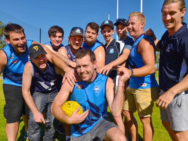 Flinders University A-grade football team president/player Dean Schofield with fellow players, Sunday, April 22, 2018. The side lost 283-0 on the weekend, it's third bad loss in a row, and things don't look like improving. Doing a callout for more players to help them out. (AAP Image/ Brenton Edwards)