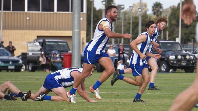 Ouyen United players hunt the footy in an earlier match against South Mildura. Picture: Michael DiFabrizio