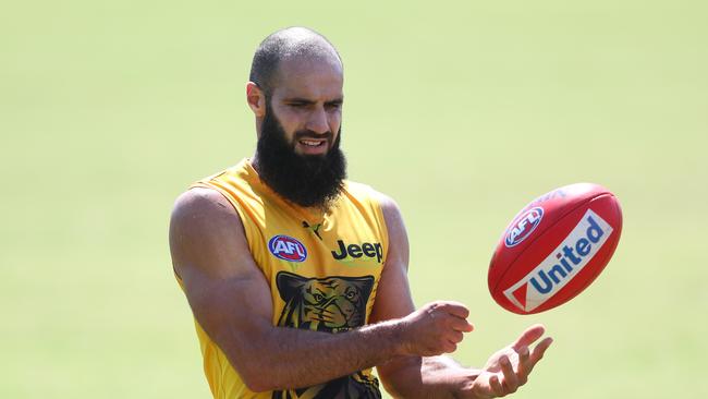 GOLD COAST, AUSTRALIA - JANUARY 30: Bachar Houli handballs during a Richmond Tigers AFL training session at Southport Sharks on January 30, 2020 in Gold Coast, Australia. (Photo by Chris Hyde/Getty Images)