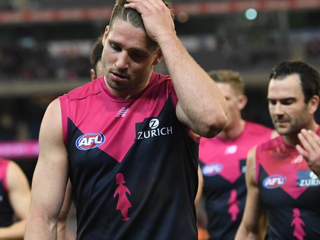 Jesse Hogan of the Demons (second from left) reacts following the Round 21 AFL match between the Melbourne Demons and the Sydney Swans at the MCG in Melbourne, Sunday, August 12, 2018. (AAP Image/Julian Smith) NO ARCHIVING, EDITORIAL USE ONLY