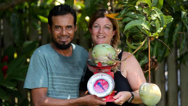 Fera and Ashley Ristano made the Cairns Post in 2018 with their 2kg mango off their Smithfield tree. PICTURE: STEWART MCLEAN