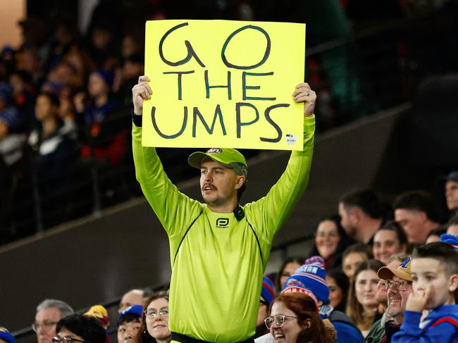 Social media star Jake Cullen, known as Choc's Chat, supports the umpire's decision to allow Lachie Neale’s goal. (Photo by Dylan Burns/AFL Photos via Getty Images)