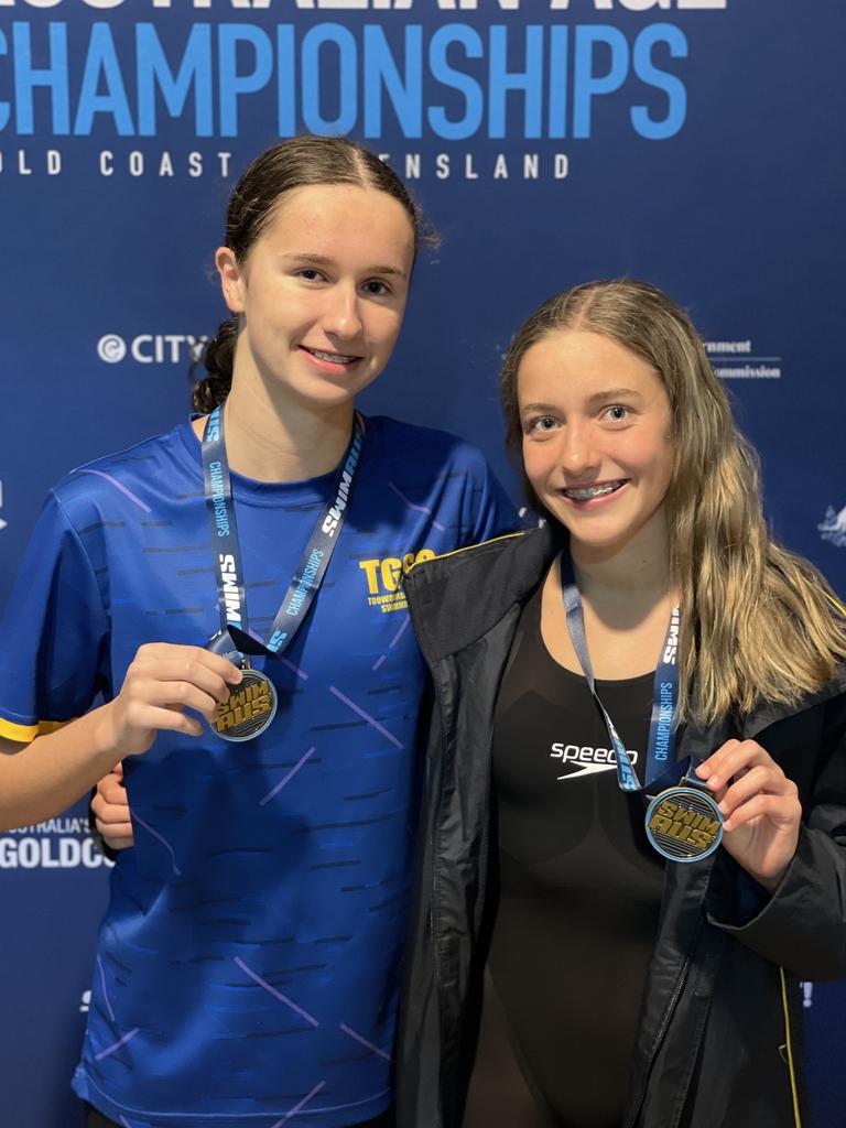 Sienna Deurloo (left) and Mackenzie Grimes (right) show off their Australian Swimming Age Championships gold medals from the recent Gold Coast titles. Picture: Contributed.