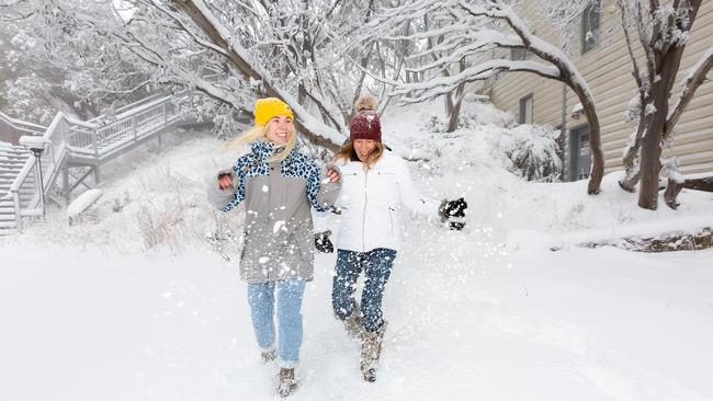 Locals Jasmine Langworthy and Rhylla Morgan enjoy the fresh snow at Mount Buller. Picture: Jordan Mountain