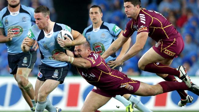 Rooster James Maloney makes a break during State of Origin at ANZ Stadium.