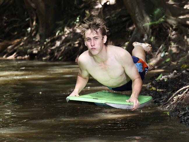 Cairns is currently experiencing hot and sticky weather typical of the start of summer. Smithfield teenager Riley Swan finds respite from the warm weather by taking a dip in the cool waters of Freshwater Creek. Picture: Brendan Radke