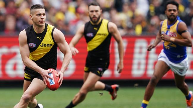 Dion Prestia powers away from congestion against West Coast. Picture: AAP Image/Michael Dodge.